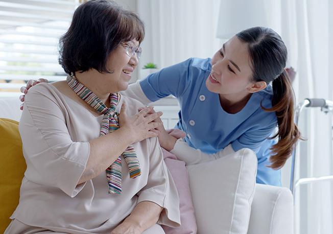 Healthcare worker assists patient